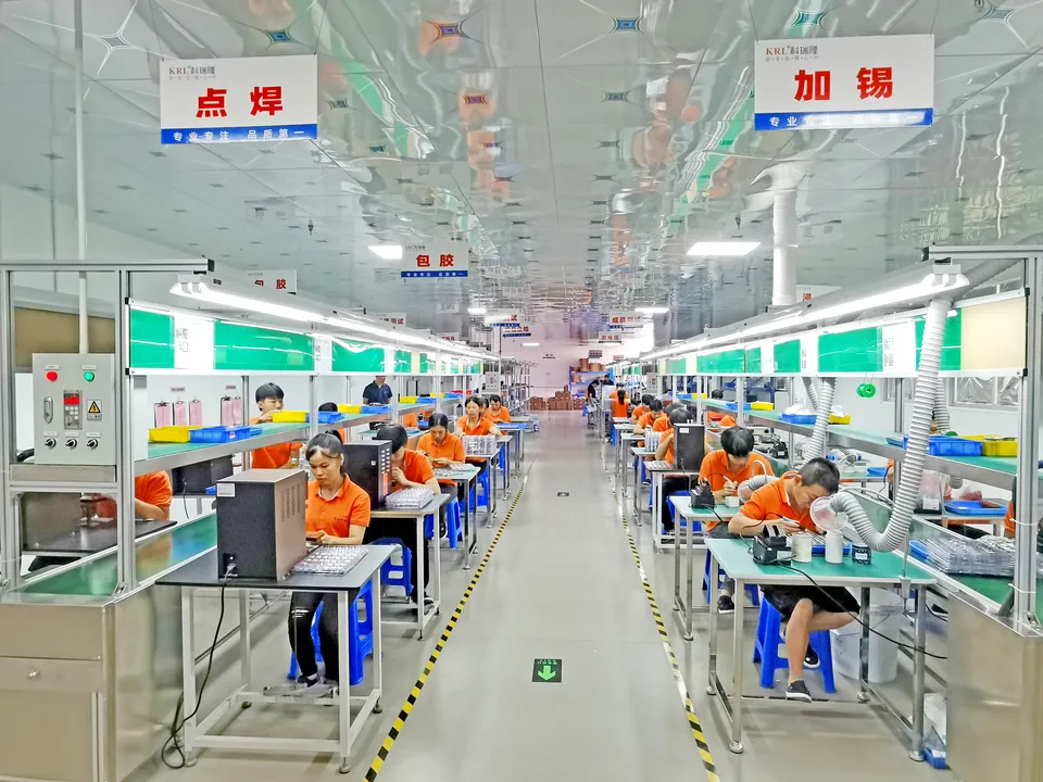 KRL battery pack production workshop with welding and assembly stations